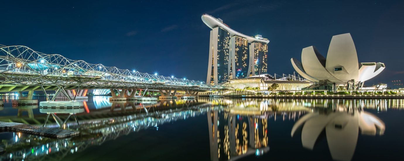 marina-bay-night-reflected-water Singapore city skyline at Marina Bay view from Singapore City - beautiful sunset city tower downtown Cityscape -night landscape Singapore city